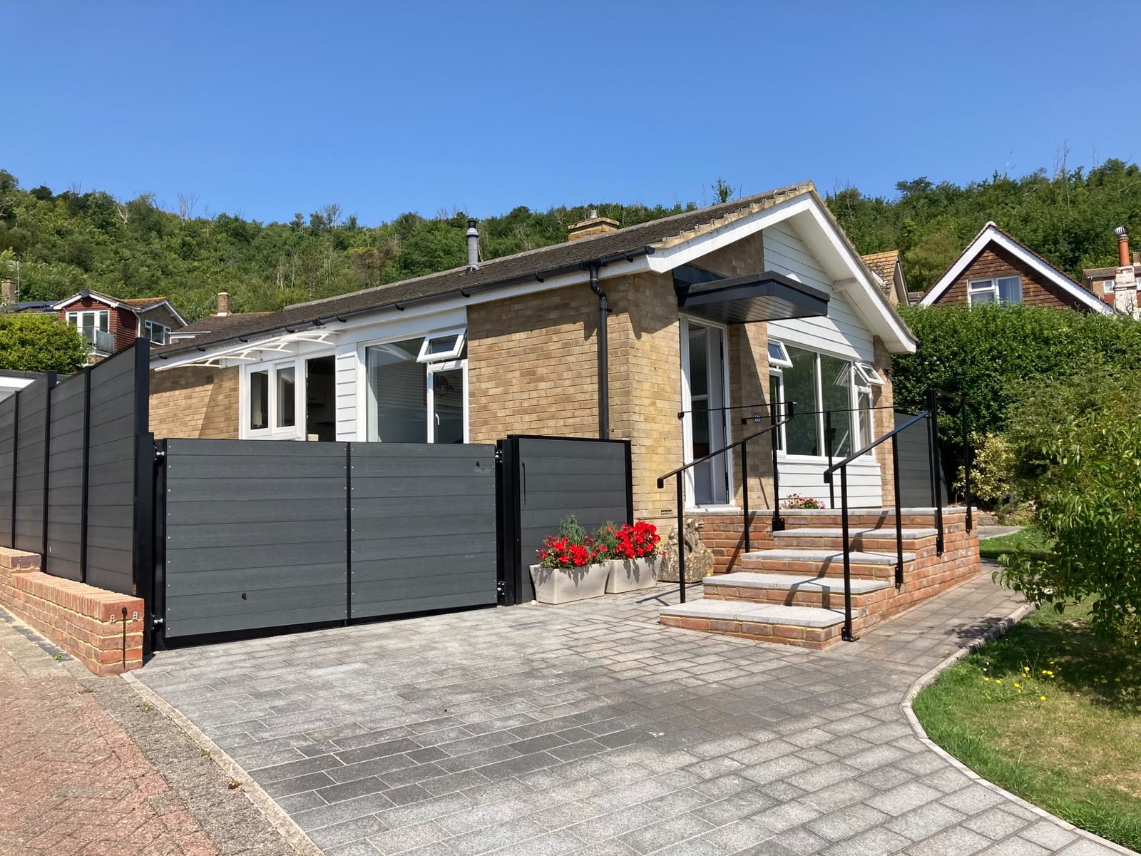Composite decking with glass balustrade by LJB Lee Botting