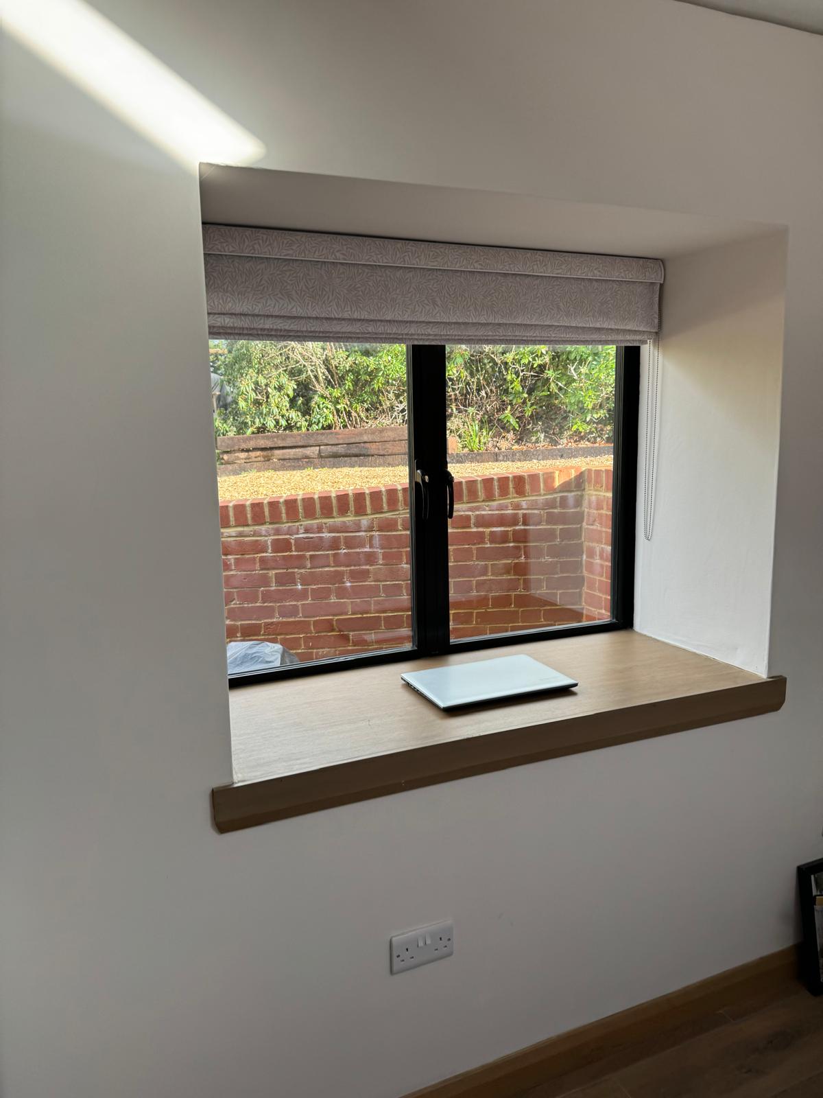 Deep window reveal and oak sill inside the completed conversion