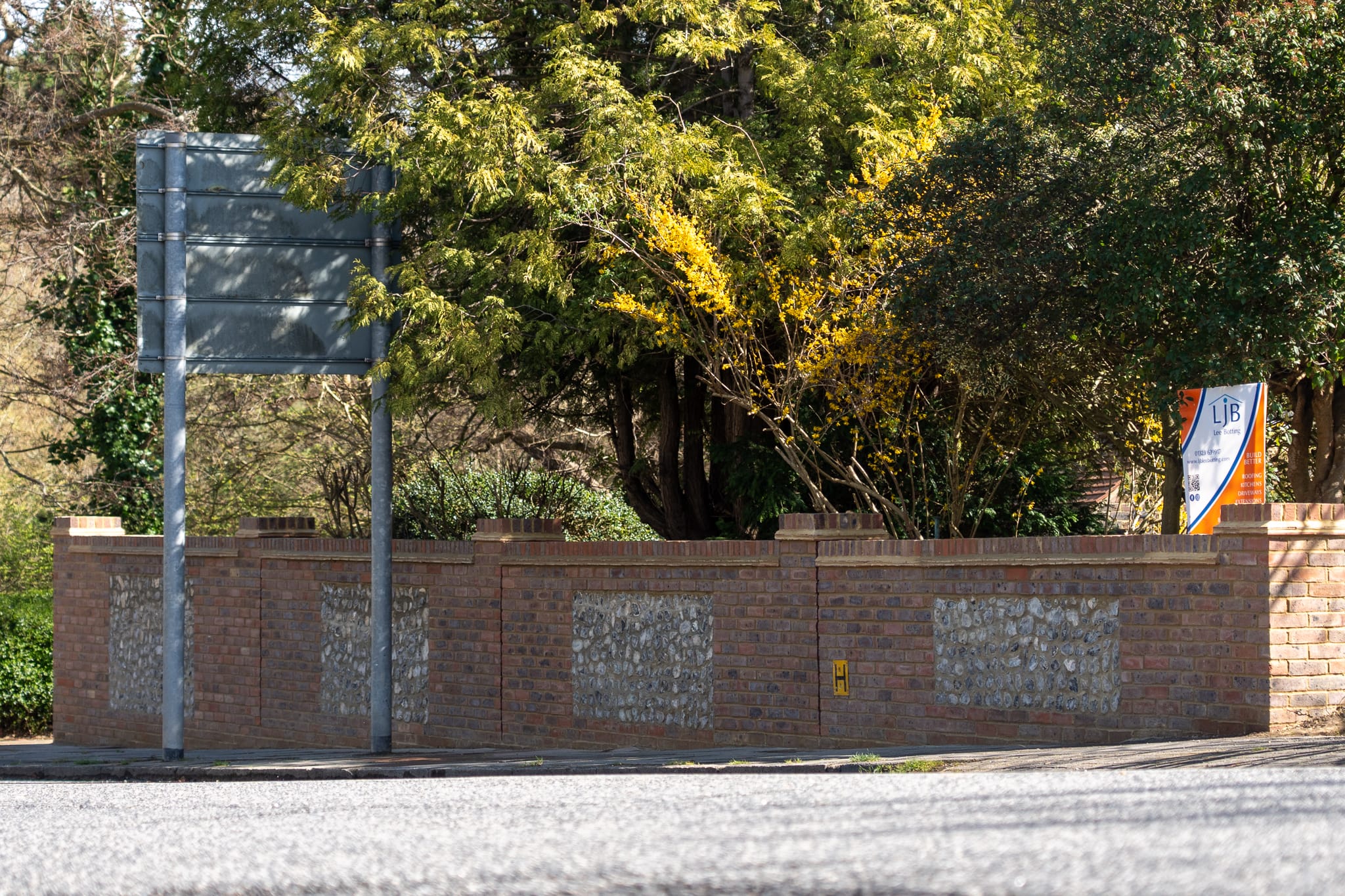 Completed brick and flint boundary wall built by LJB Lee Botting