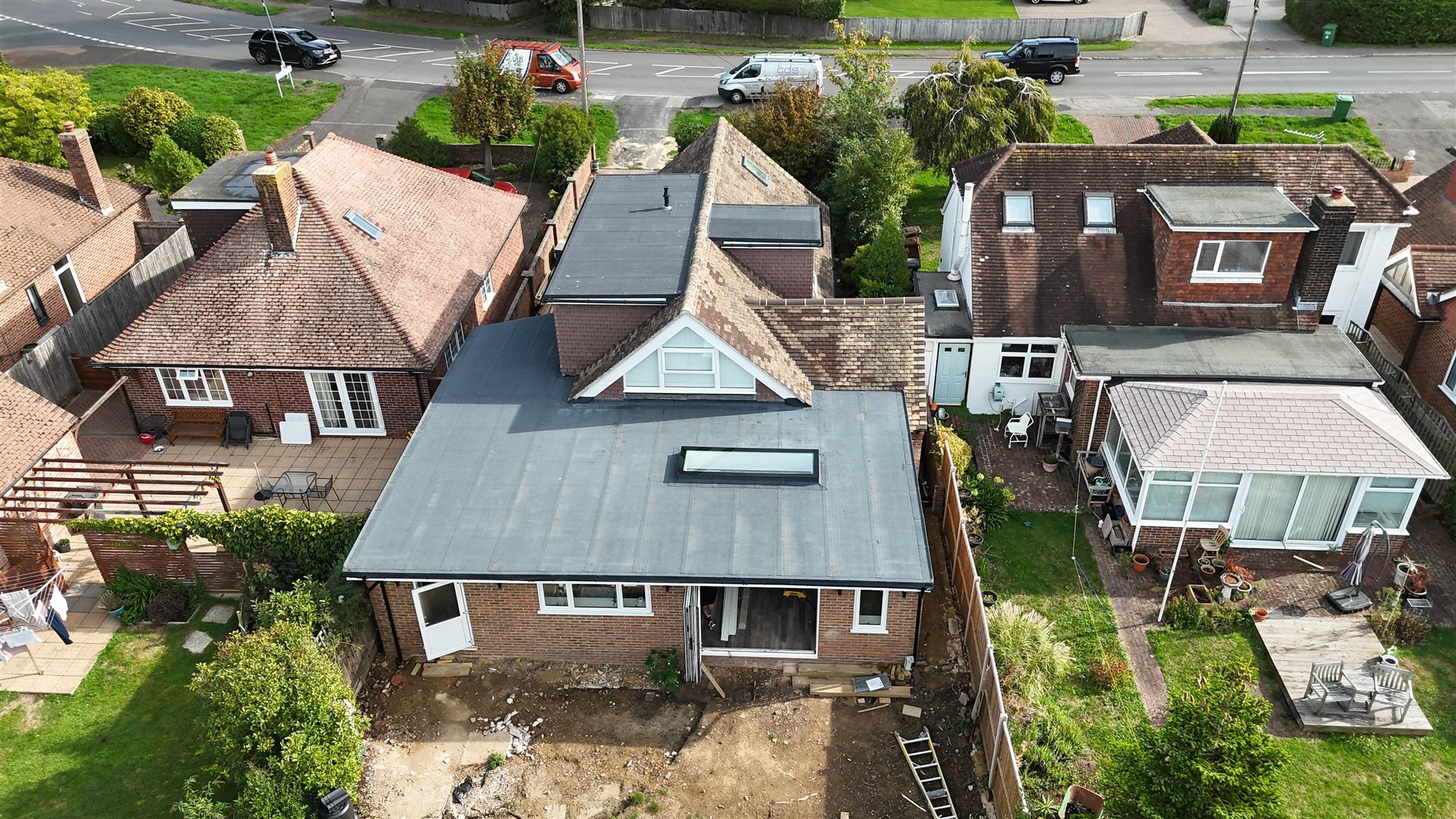 Aerial view of a flat-roof extension with rooflights