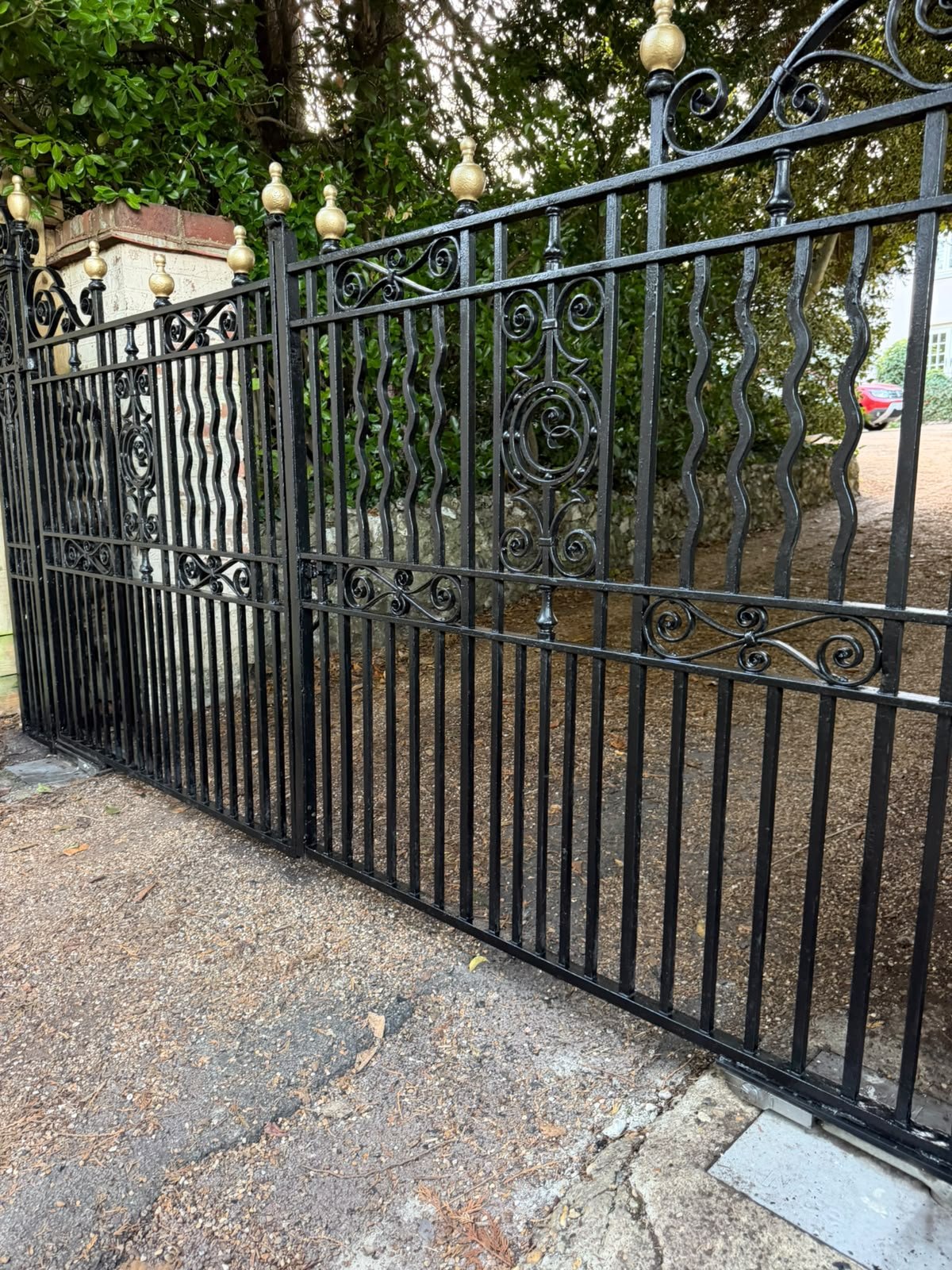 Close view of restored wrought-iron gate details