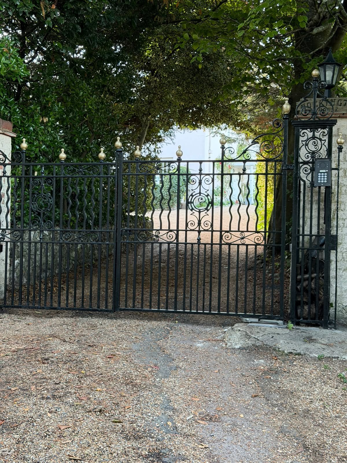Restored decorative driveway gates at a period East Sussex property