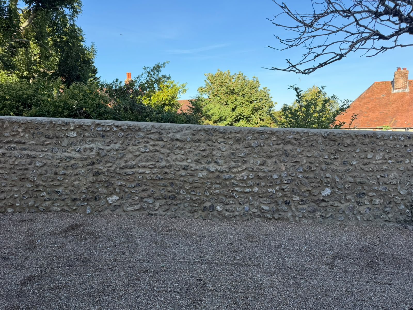 Wide view of a carefully restored traditional flint wall
