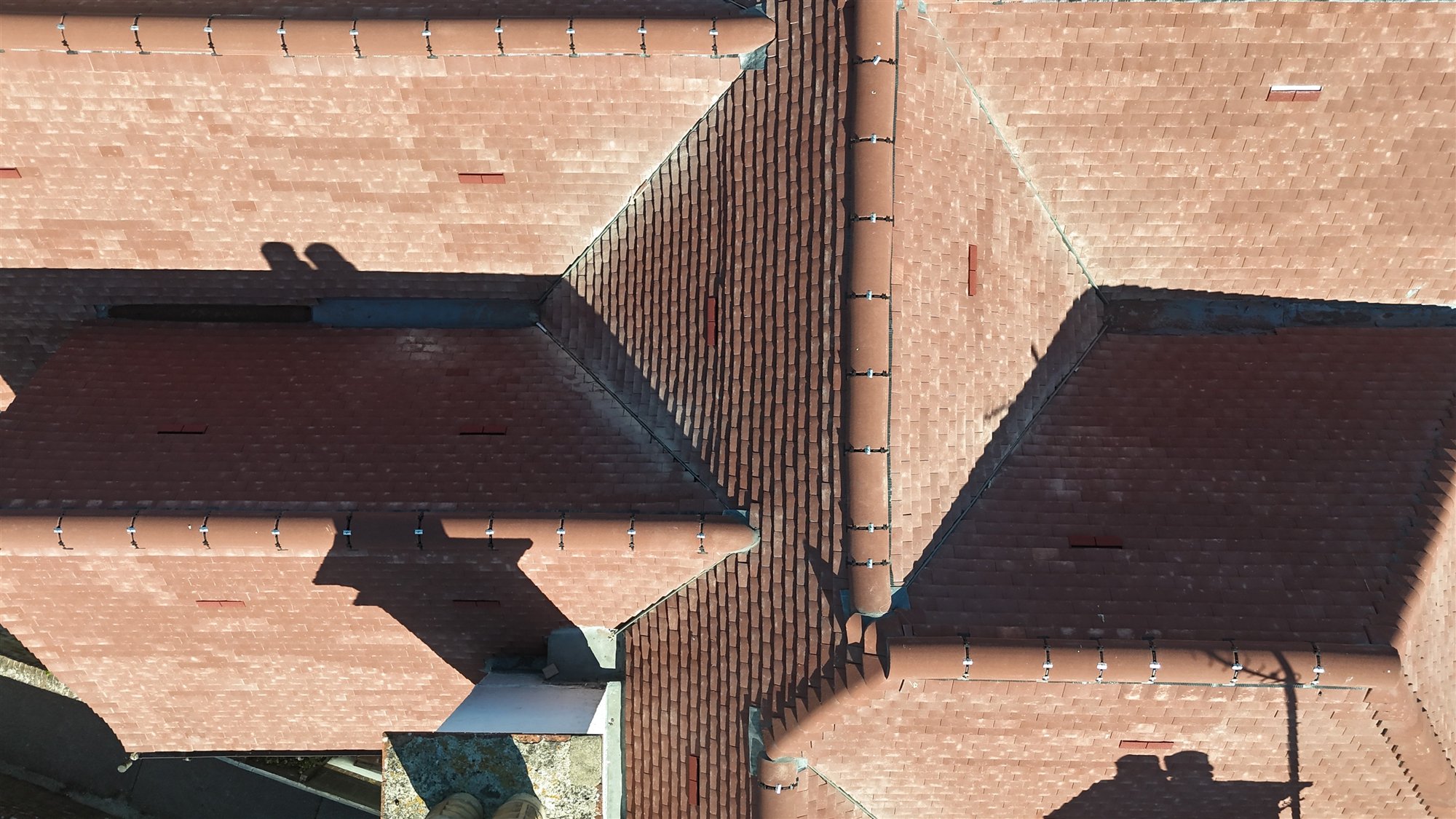 Aerial close-up of tiled roof valleys and junction details
