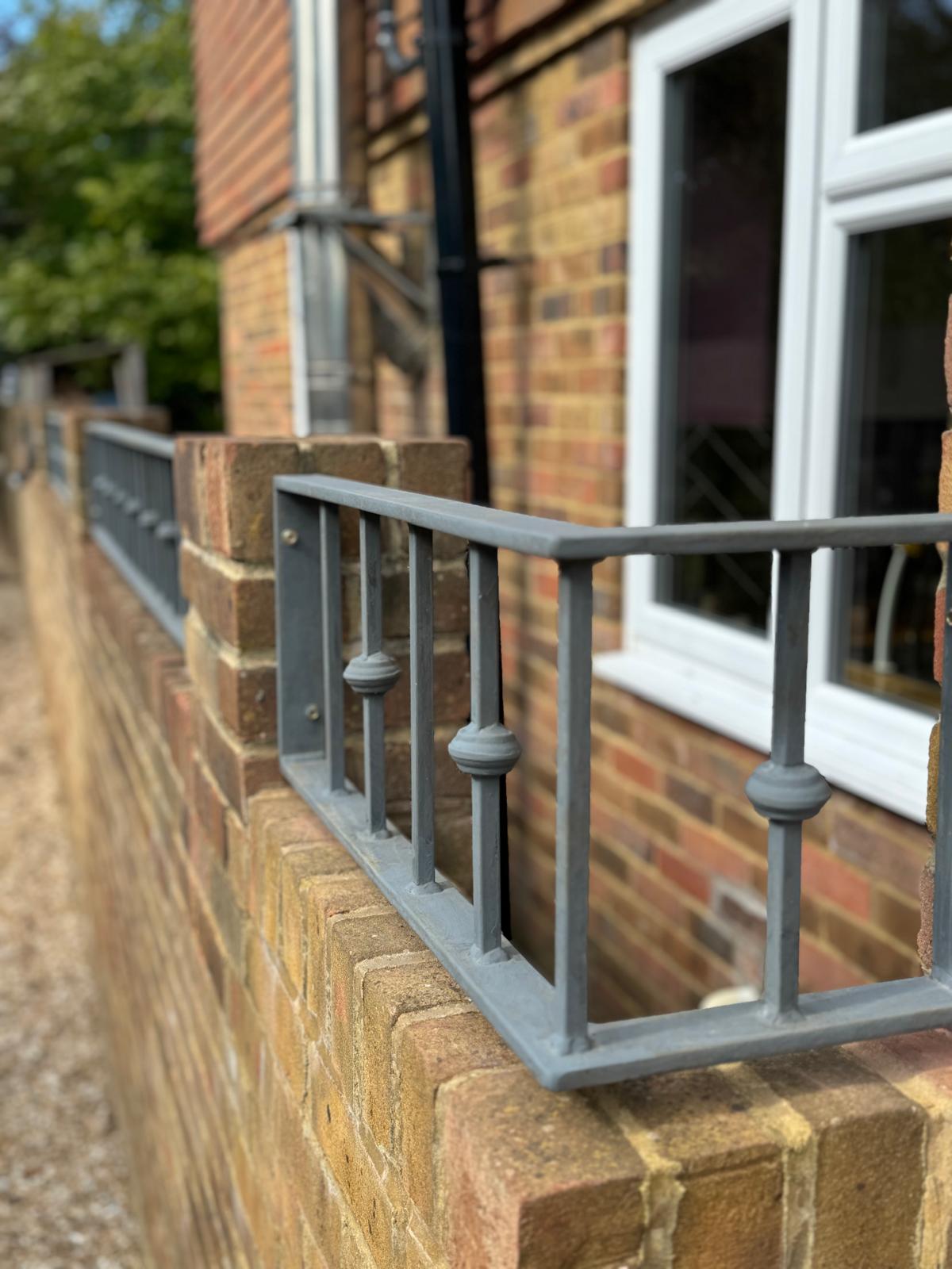 Bespoke metal balustrade beside external steps