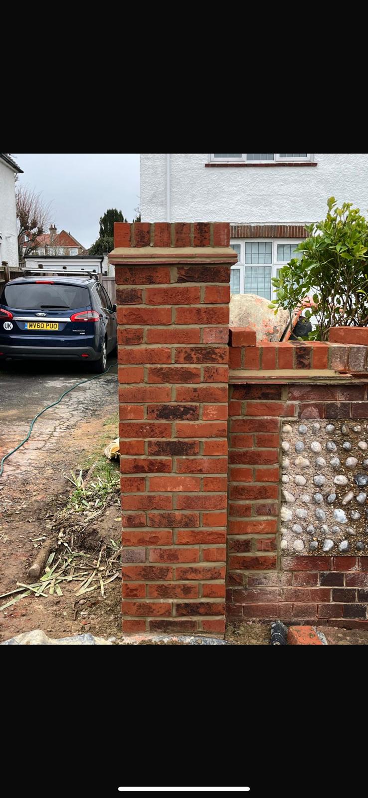 Traditional brick and flint garden wall