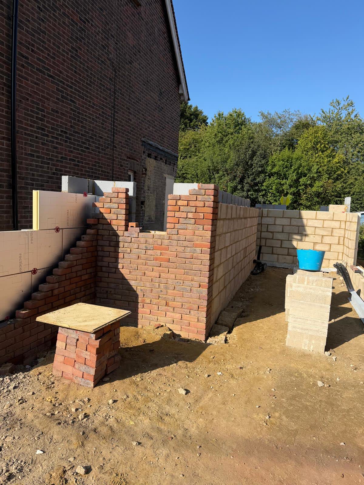 New brick garden wall under construction