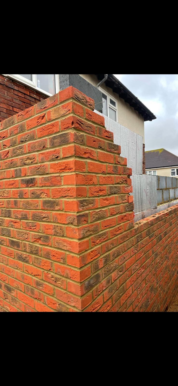 New red brick pier with clean bonded brickwork