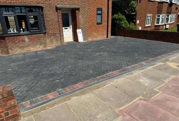 Completed charcoal block-paved driveway with contrasting border