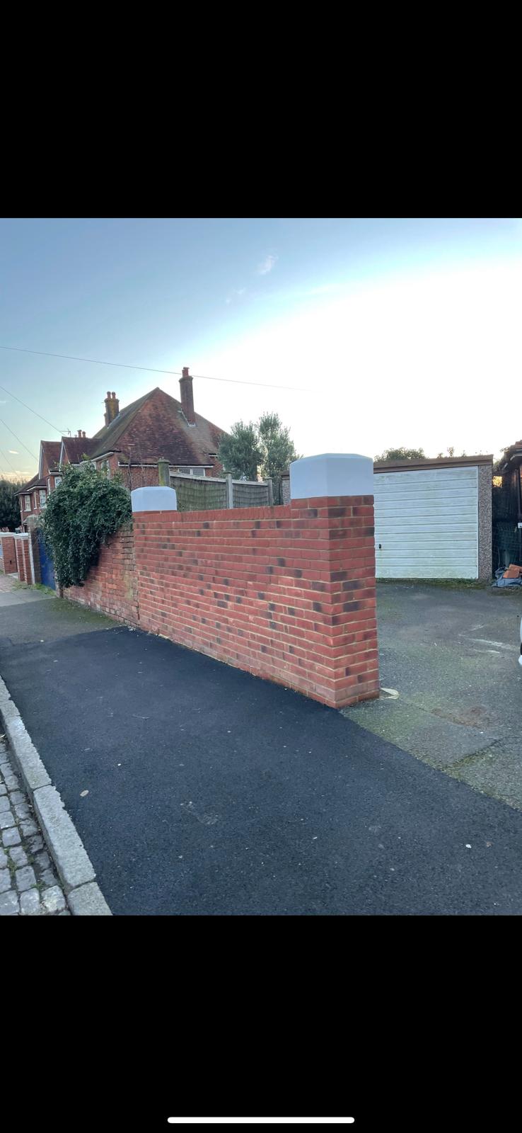 Completed red brick boundary wall and entrance