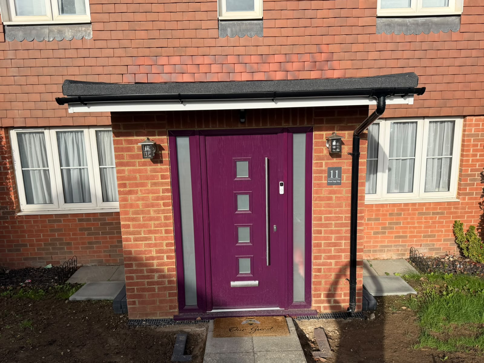 Completed brick entrance porch with double front doors