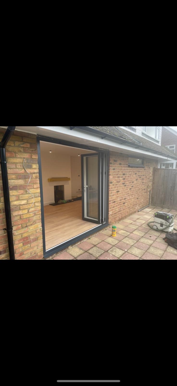 Completed brick extension with open bifold doors