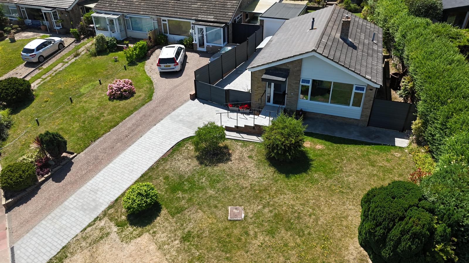 Aerial view of a completed home extension and garden