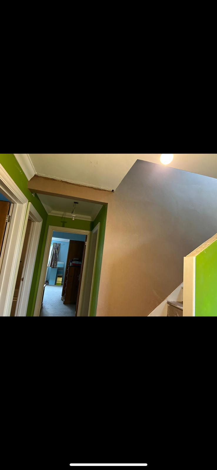Redecorated hallway with a clean two-colour finish