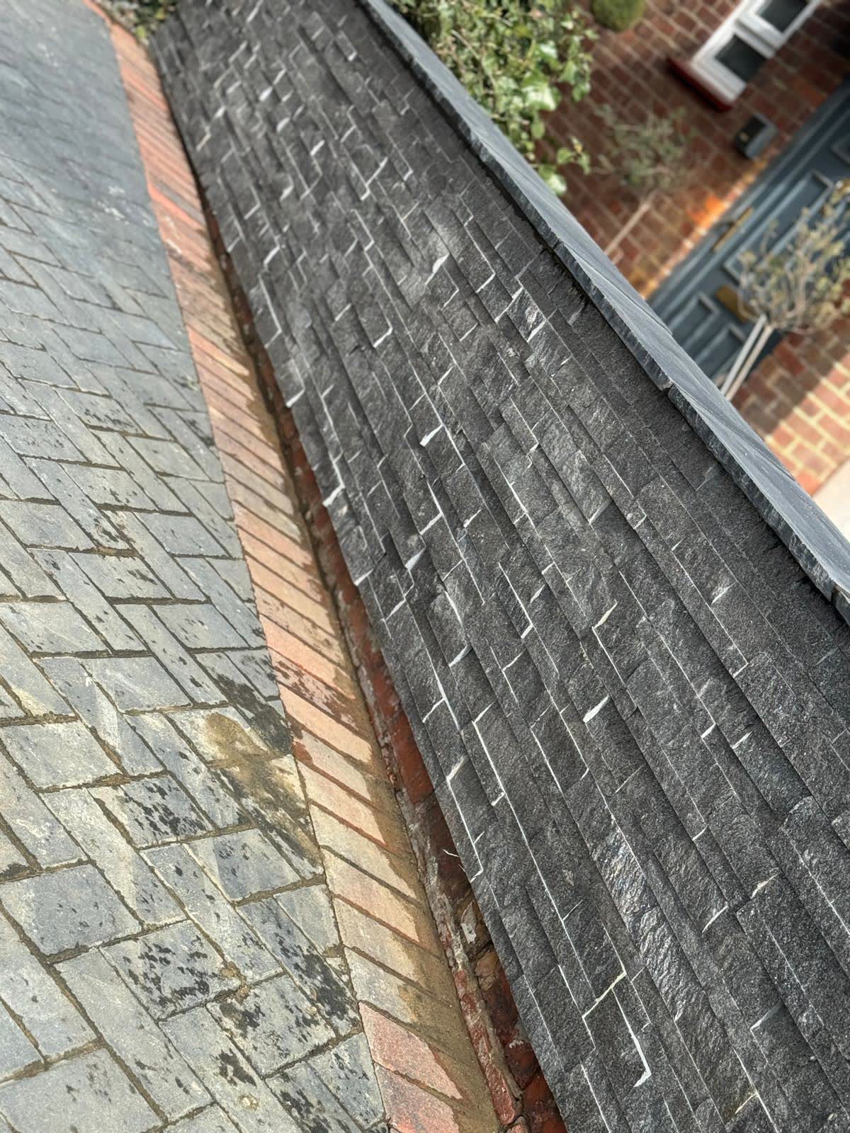Close view of natural slate roofing and abutment details