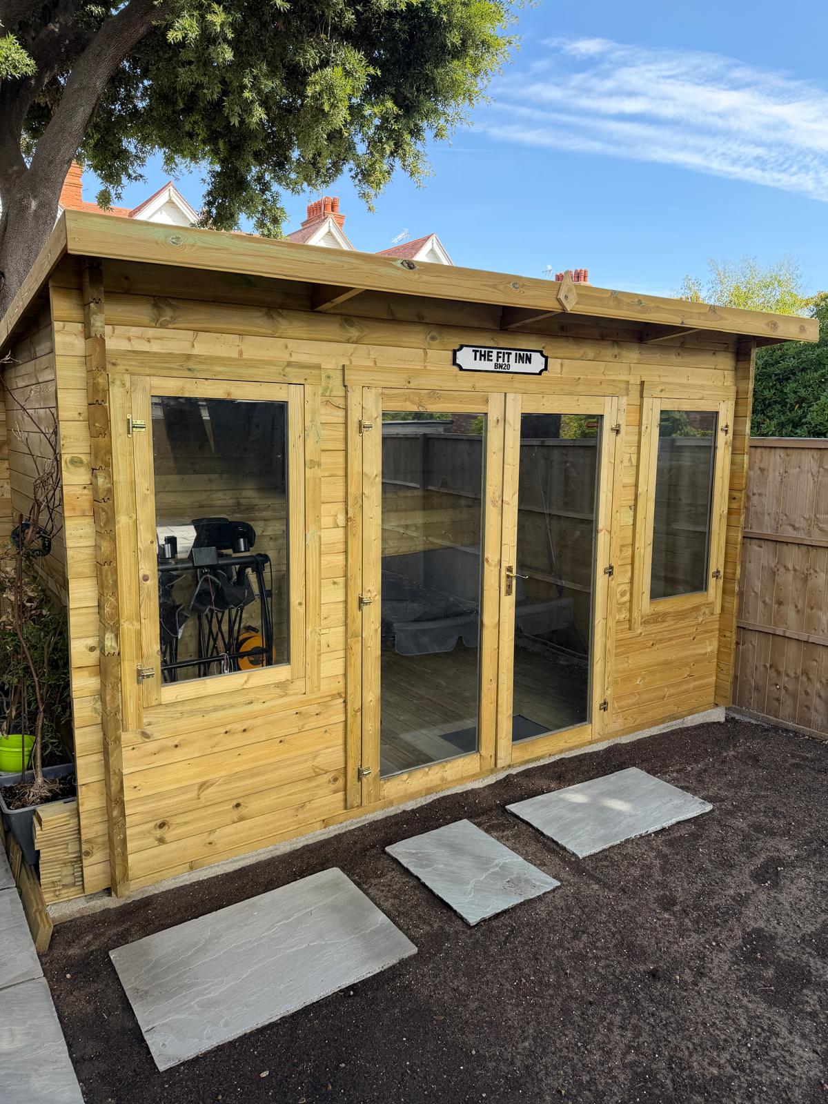 Timber garden workshop with glazed double doors